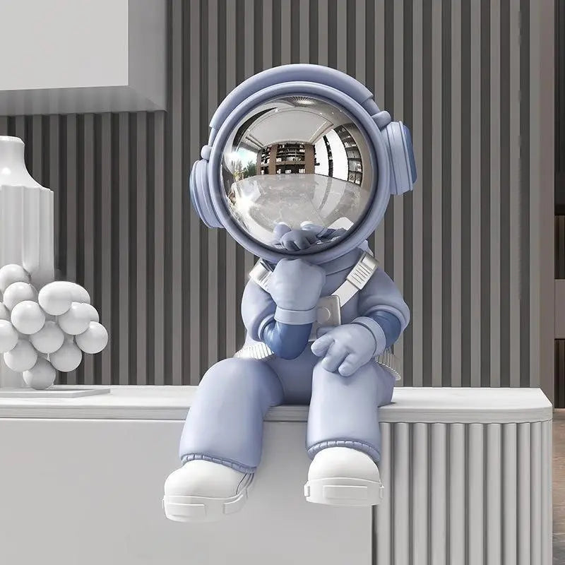 Seated Astronaut Figurine with Mirrored Visor in Blue