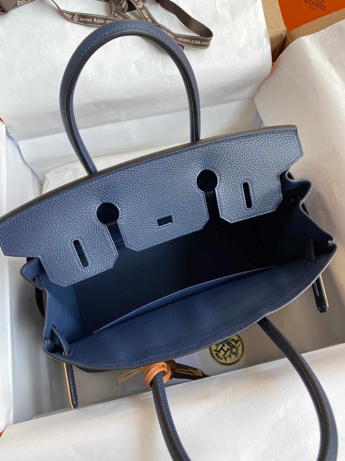 Navy Blue Leather Top-Handle Handbag with Gold Hardware and Horse Charm