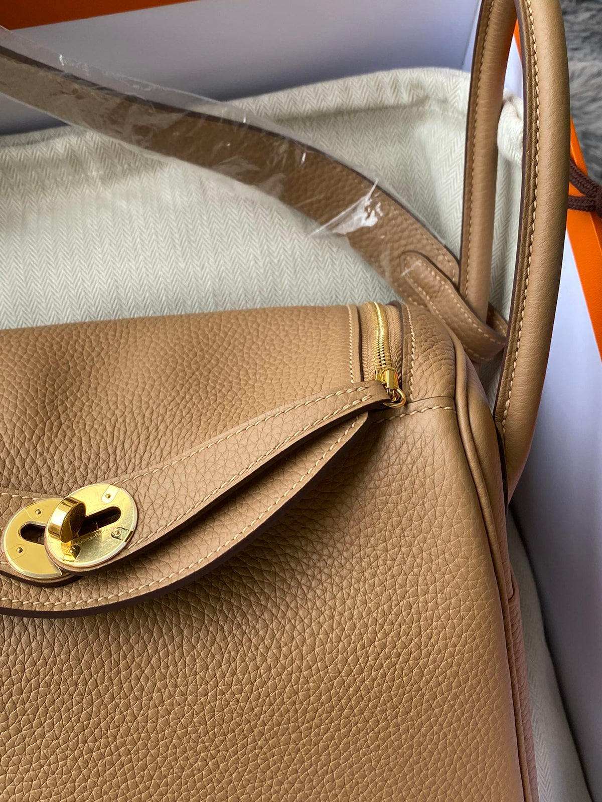 Hermès Lindy Handbag in Tan Leather with Gold-Tone Hardware