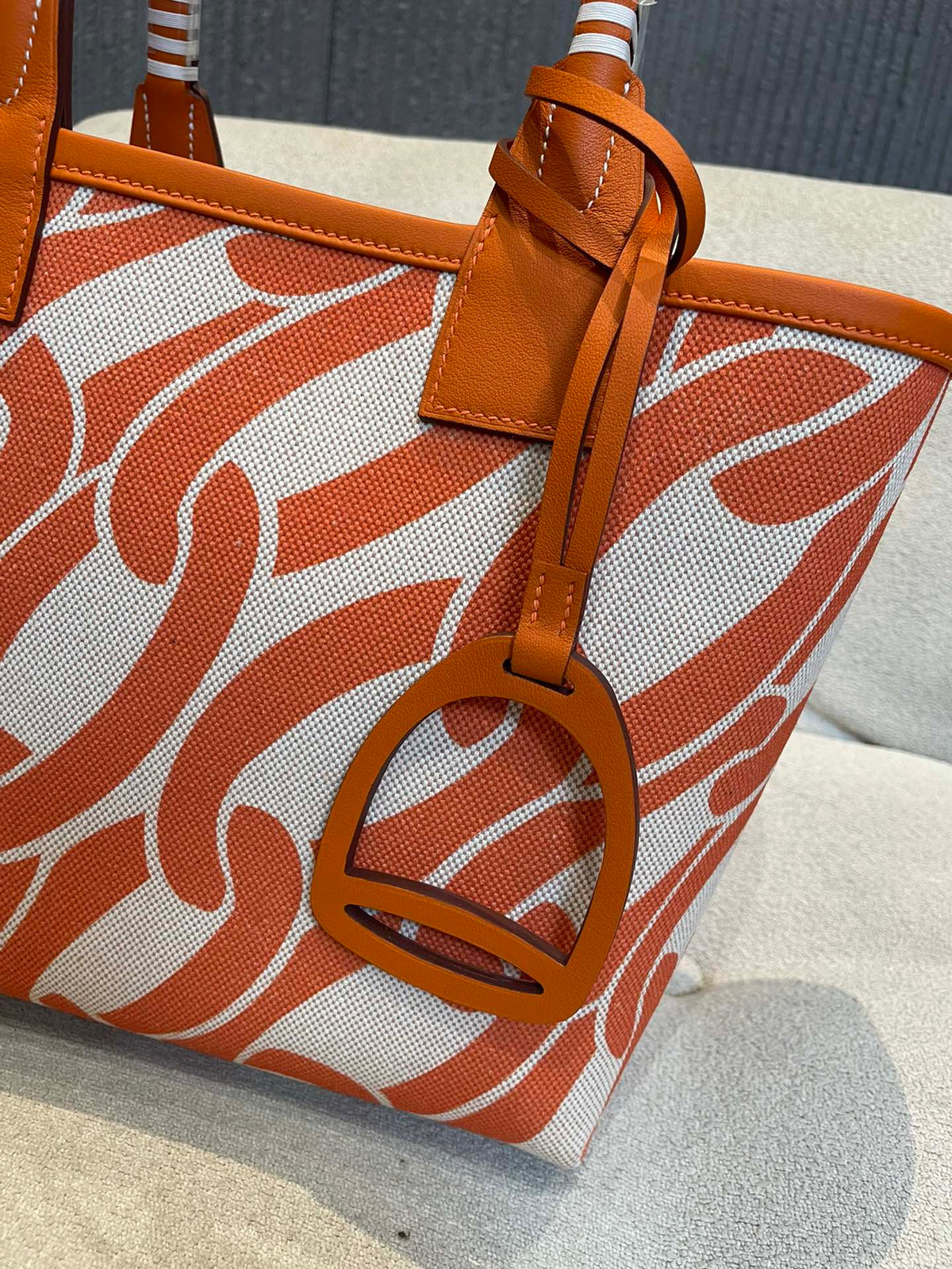 Orange Chain Link Pattern Canvas Tote Bag with Leather Top Handles and Stirrup Charm