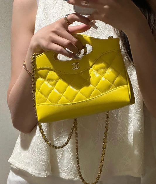 Yellow Quilted Mini Handbag with Gold Chain Strap and Top Handle